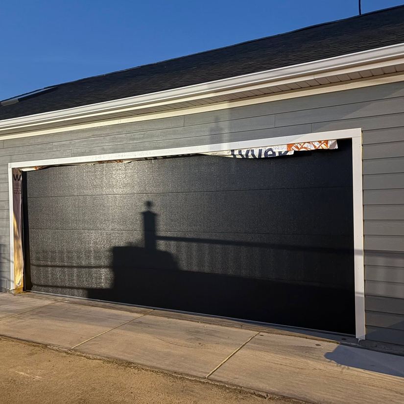Finished black garage door installation, Chicago