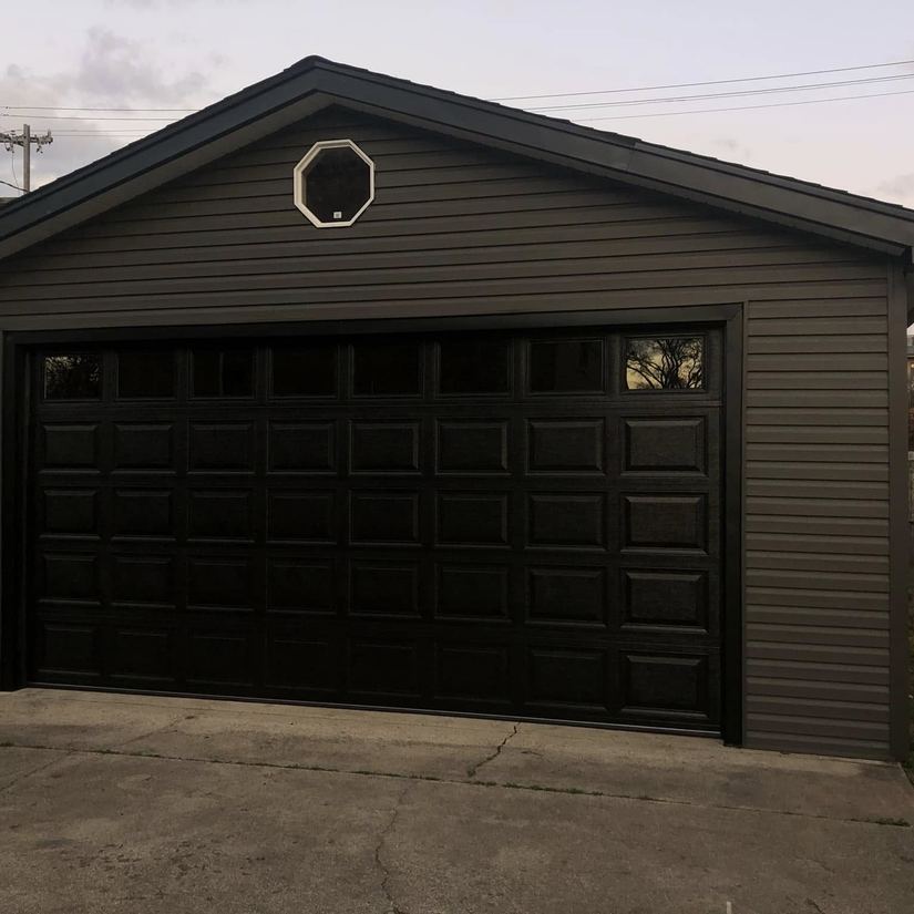 Dark panel garage door with octagon window, Chicago